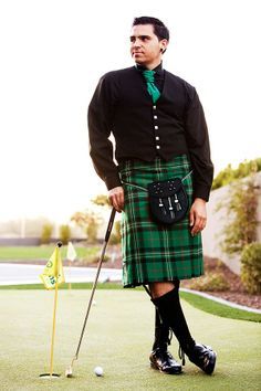 Man in a kilt with a golf stick