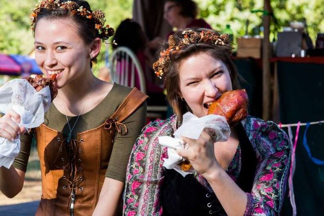 Two Girls trying OUt some Food At Renaissance Fair